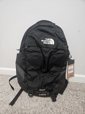 The North Face Surge Backpack in Black with White Logo